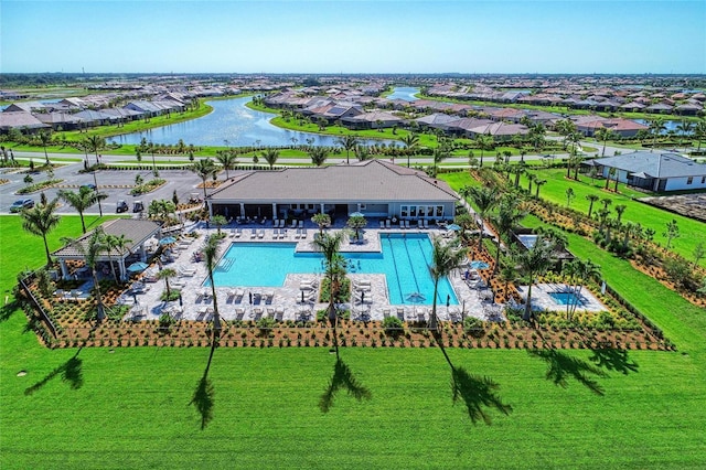 aerial view with a residential view and a water view