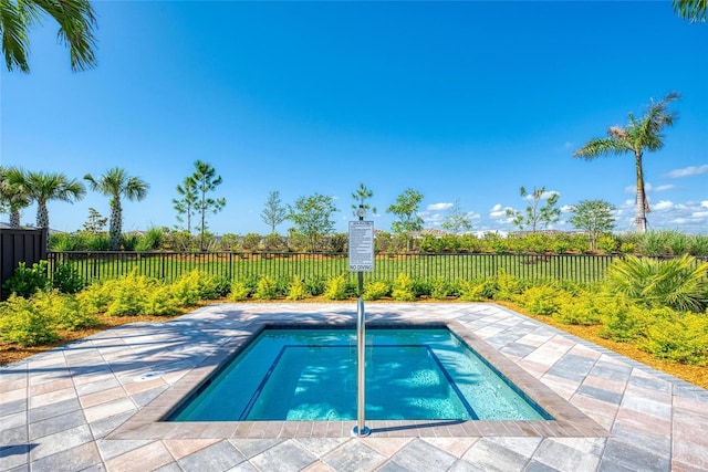 view of pool featuring a pool, a fenced backyard, and a patio