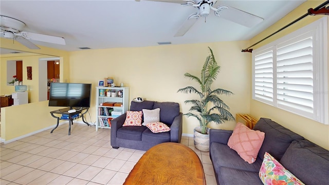 living area with visible vents, ceiling fan, and tile patterned flooring