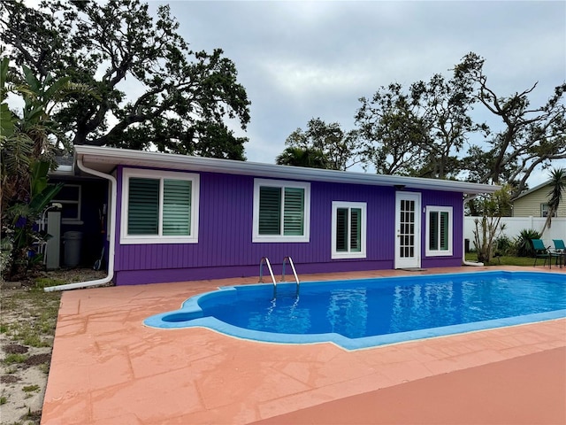 view of swimming pool with fence, a patio, and a fenced in pool