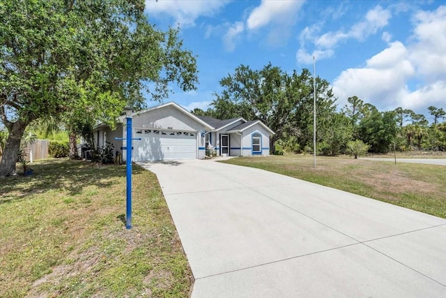 ranch-style house with an attached garage, driveway, stucco siding, and a front lawn