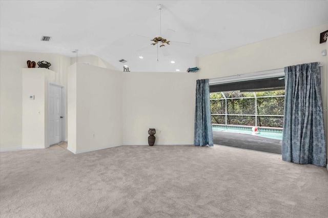 carpeted spare room with ceiling fan, visible vents, recessed lighting, lofted ceiling, and baseboards
