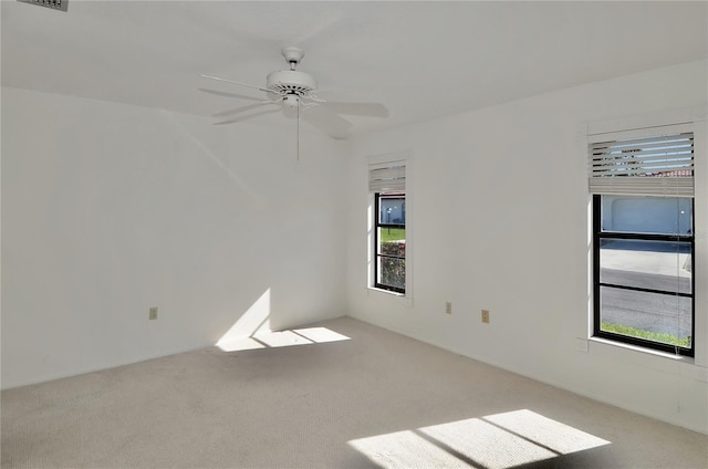 carpeted empty room with ceiling fan