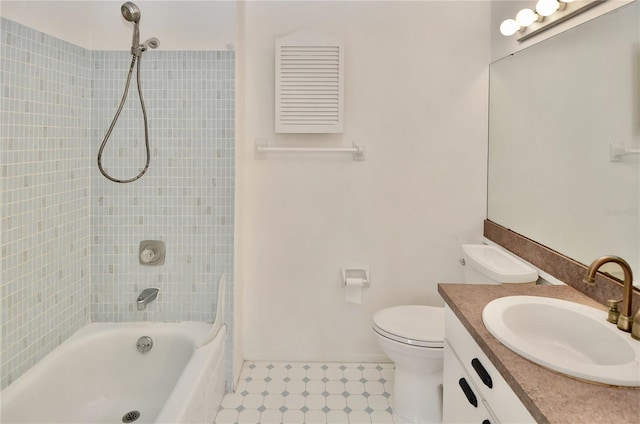 bathroom featuring toilet, shower / bath combination, and vanity