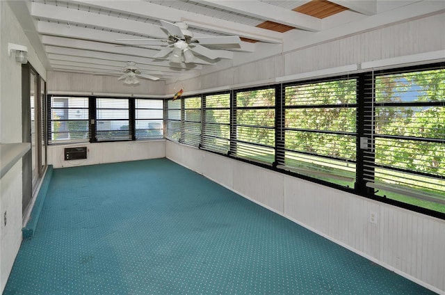 unfurnished sunroom featuring beam ceiling and ceiling fan