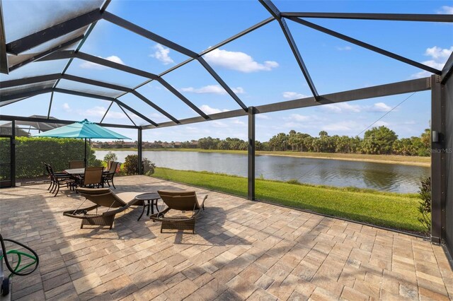 1254 Cielo Ct, North Venice, FL 34275 - view of patio / terrace featuring a lanai, outdoor dining area, and a water view