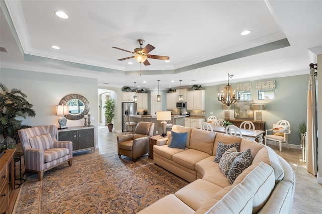 1254 Cielo Ct, North Venice, FL 34275 - living area with visible vents, recessed lighting, ceiling fan with notable chandelier, crown molding, and a raised ceiling