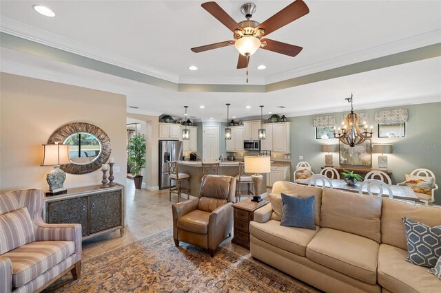 1254 Cielo Ct, North Venice, FL 34275 - living area with recessed lighting, a tray ceiling, and ceiling fan with notable chandelier