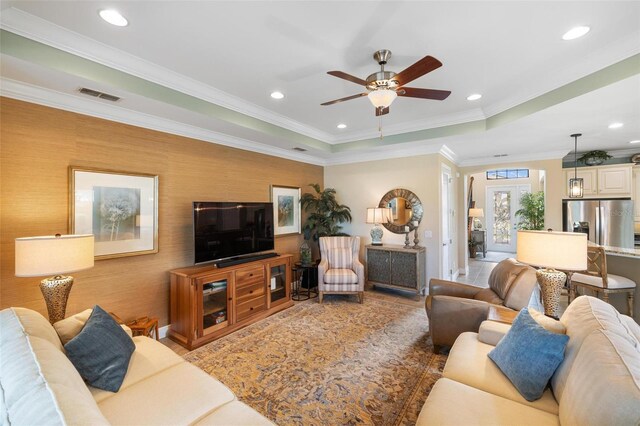 1254 Cielo Ct, North Venice, FL 34275 - living room featuring recessed lighting, a tray ceiling, visible vents, crown molding, and ceiling fan