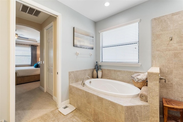 1254 Cielo Ct, North Venice, FL 34275 - bathroom with a tile shower, visible vents, a ceiling fan, a garden tub, and ensuite bathroom