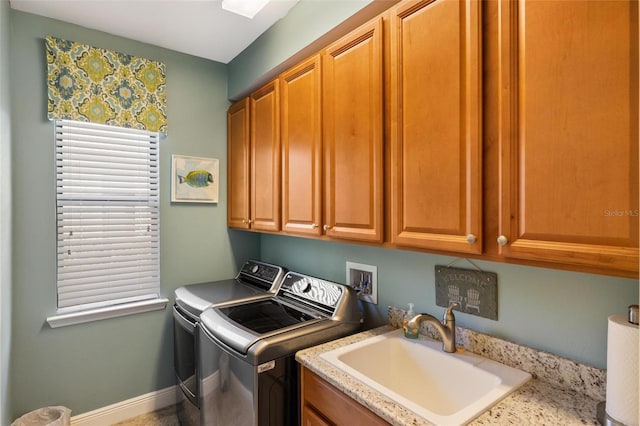 1254 Cielo Ct, North Venice, FL 34275 - washroom with cabinet space, washer and clothes dryer, baseboards, and a sink