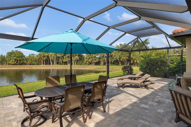 1254 Cielo Ct, North Venice, FL 34275 - view of patio featuring a lanai, outdoor dining area, and a water view