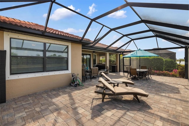 1254 Cielo Ct, North Venice, FL 34275 - view of patio / terrace with a lanai, a ceiling fan, and outdoor dining area