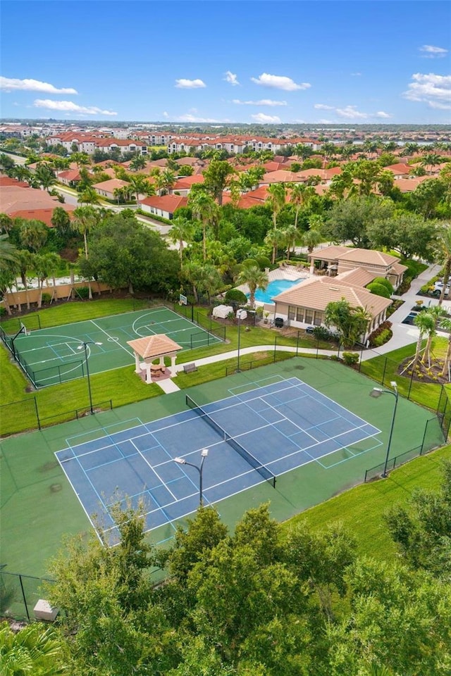 1254 Cielo Ct, North Venice, FL 34275 - view of tennis court with fence and a lawn