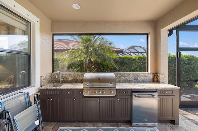 1254 Cielo Ct, North Venice, FL 34275 - view of patio featuring exterior kitchen, a sink, and a grill