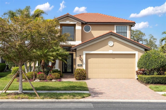 1254 Cielo Ct, North Venice, FL 34275 - mediterranean / spanish-style house featuring stucco siding, a tile roof, and driveway