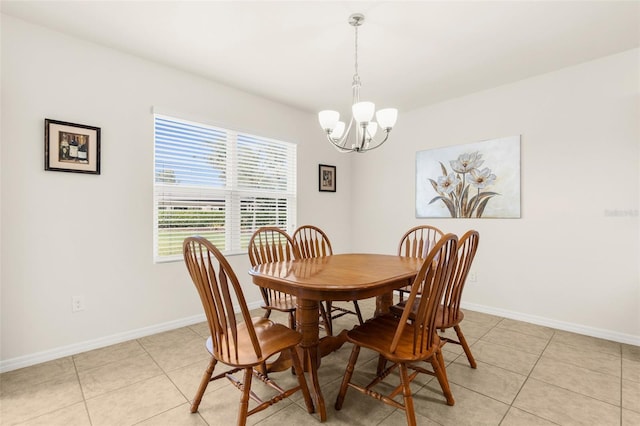 25525 Lambert Ln, Punta Gorda, FL 33950 - dining room with light tile patterned floors, baseboards, and an inviting chandelier