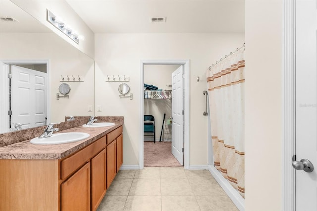 25525 Lambert Ln, Punta Gorda, FL 33950 - full bathroom featuring tile patterned floors, double vanity, visible vents, and a sink