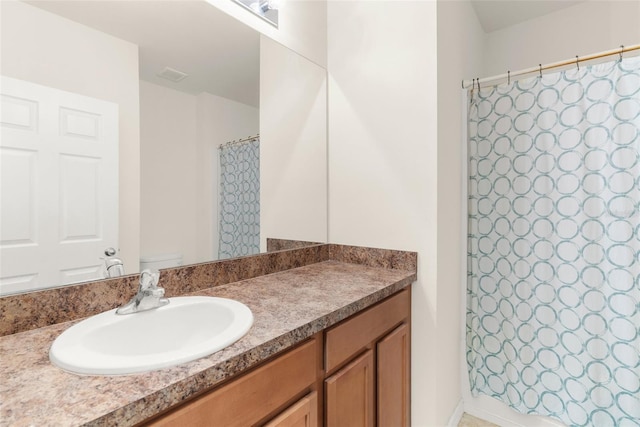 25525 Lambert Ln, Punta Gorda, FL 33950 - bathroom featuring a shower with shower curtain, vanity, visible vents, and toilet