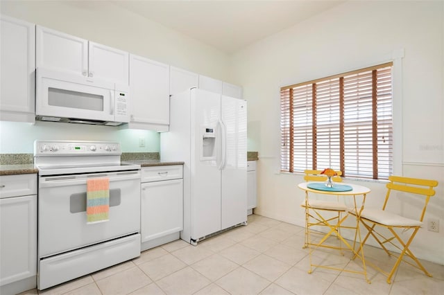 1007 Gondola Park Dr Unit 1007, Venice, FL 34292 - kitchen featuring white appliances and white cabinets