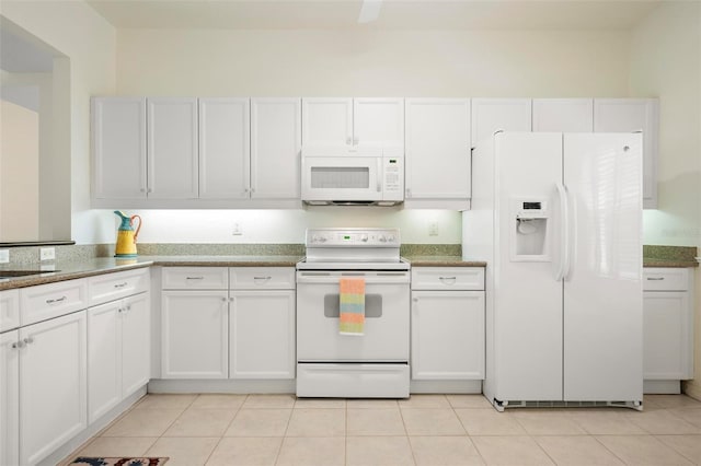 1007 Gondola Park Dr Unit 1007, Venice, FL 34292 - kitchen with white appliances, white cabinetry, light tile patterned floors, and stone counters