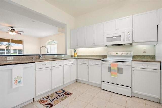 1007 Gondola Park Dr Unit 1007, Venice, FL 34292 - kitchen with white appliances, white cabinets, a ceiling fan, and light tile patterned flooring
