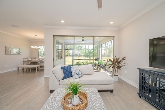 288 Soliera St, Nokomis, FL 34275 - living area with crown molding, baseboards, light wood-style flooring, and ceiling fan with notable chandelier