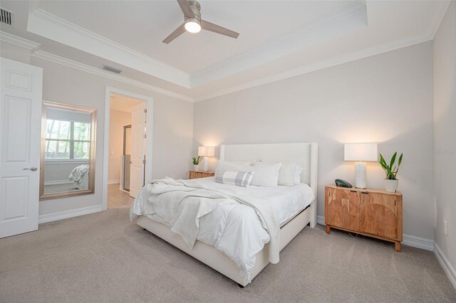 288 Soliera St, Nokomis, FL 34275 - bedroom with visible vents, crown molding, baseboards, light carpet, and a tray ceiling