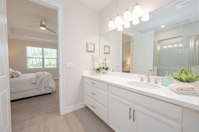 288 Soliera St, Nokomis, FL 34275 - bathroom featuring vanity, baseboards, a shower stall, a ceiling fan, and ensuite bathroom