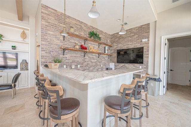 288 Soliera St, Nokomis, FL 34275 - bar featuring stone finish floor, visible vents, indoor wet bar, and brick wall
