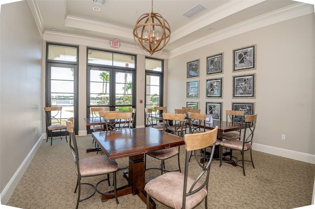 288 Soliera St, Nokomis, FL 34275 - dining room with plenty of natural light, visible vents, a raised ceiling, and an inviting chandelier