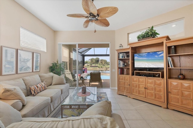 living room with ceiling fan and light tile patterned floors