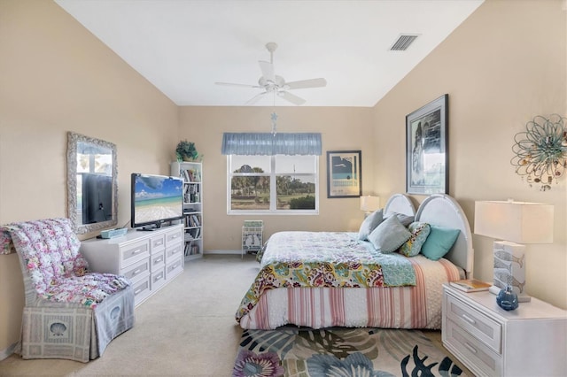 bedroom with baseboards, ceiling fan, visible vents, and light colored carpet