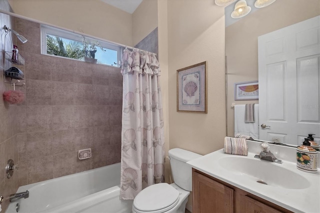 full bath with toilet, vanity, and shower / tub combo