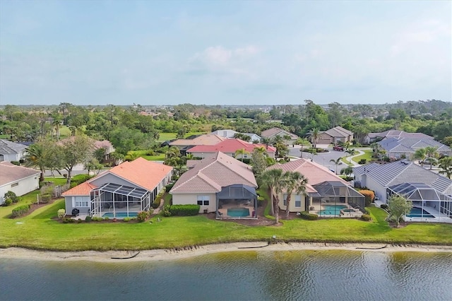 bird's eye view featuring a residential view and a water view