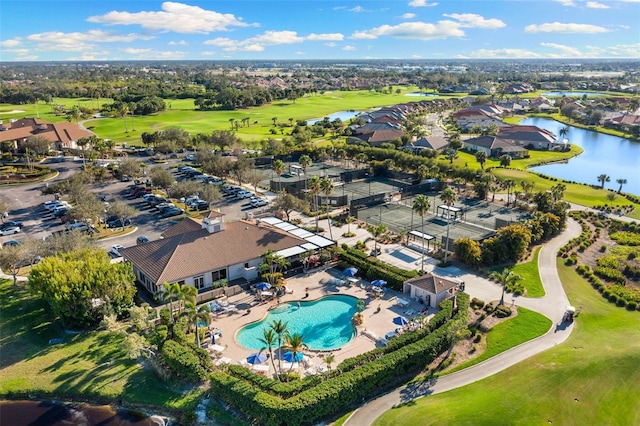 bird's eye view featuring golf course view and a water view