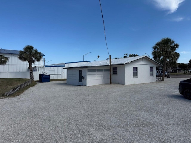 view of property exterior with fence