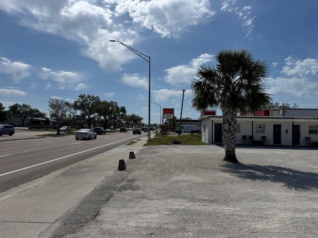 view of road with street lights and sidewalks