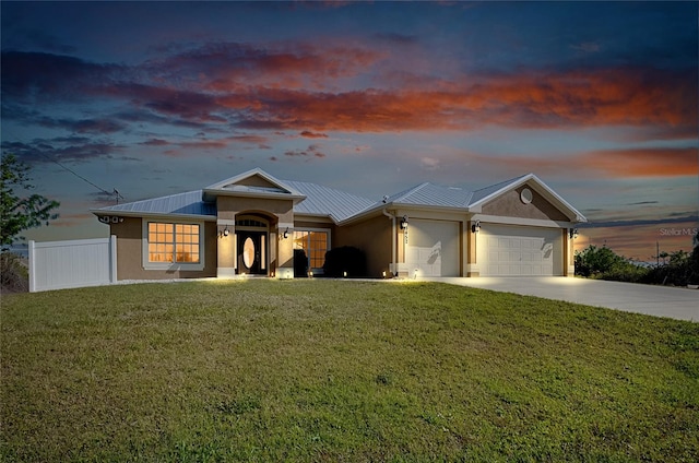 13452 High Springs Ave, Port Charlotte, FL 33981 - ranch-style home with a metal roof, stucco siding, an attached garage, concrete driveway, and a standing seam roof