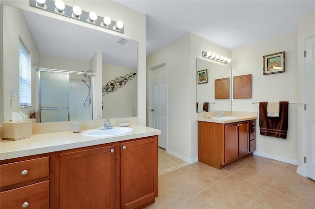 13452 High Springs Ave, Port Charlotte, FL 33981 - bathroom with a stall shower, two vanities, and tile patterned flooring