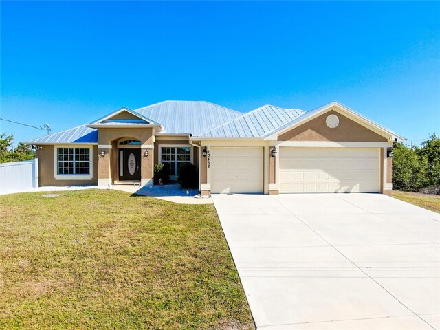 13452 High Springs Ave, Port Charlotte, FL 33981 - single story home featuring a garage, a metal roof, stucco siding, and a front lawn
