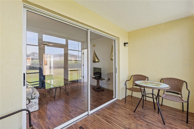 sunroom featuring ceiling fan