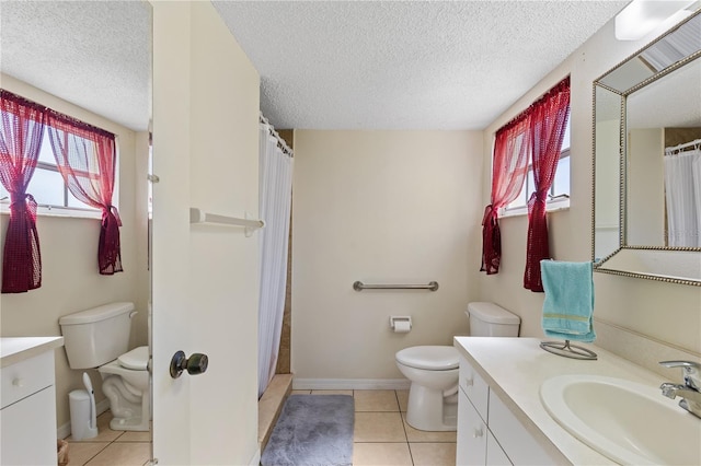 full bathroom with tile patterned flooring, vanity, toilet, a shower with shower curtain, and a textured ceiling