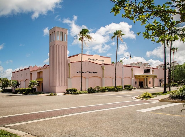 view of building exterior featuring uncovered parking