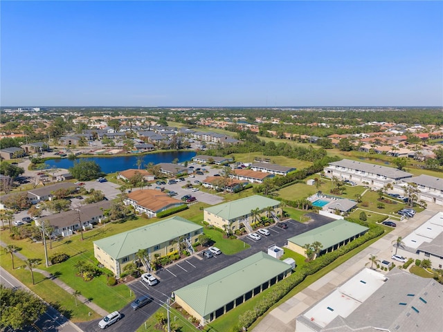 aerial view with a residential view and a water view