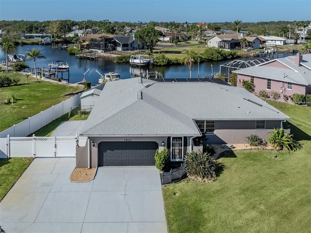 birds eye view of property with a residential view and a water view