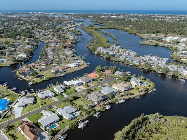 bird's eye view featuring a water view and a residential view