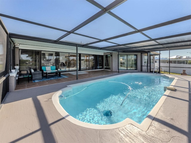 view of swimming pool with glass enclosure, an outdoor hangout area, a patio, and a fenced in pool