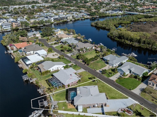 aerial view with a water view and a residential view