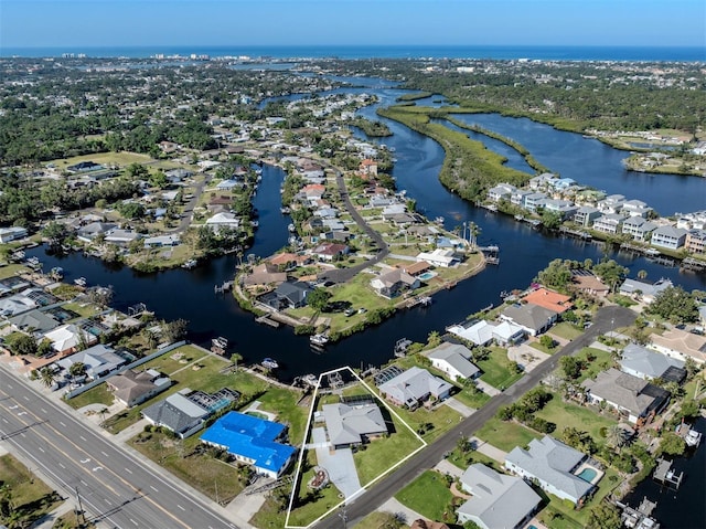 aerial view with a residential view and a water view